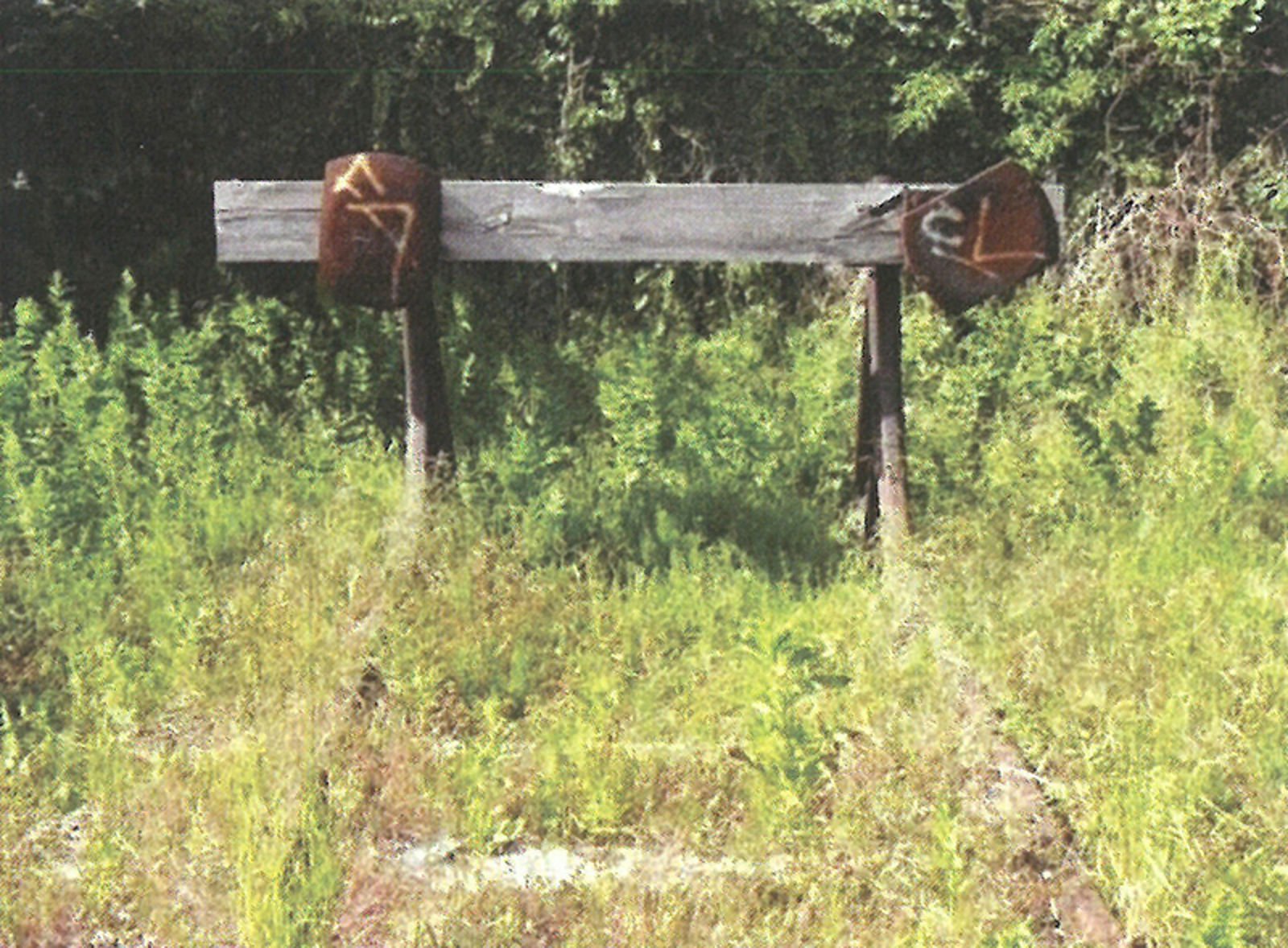 Sporstopper med oppbøyde skinner og treplanke i enden av sporet.