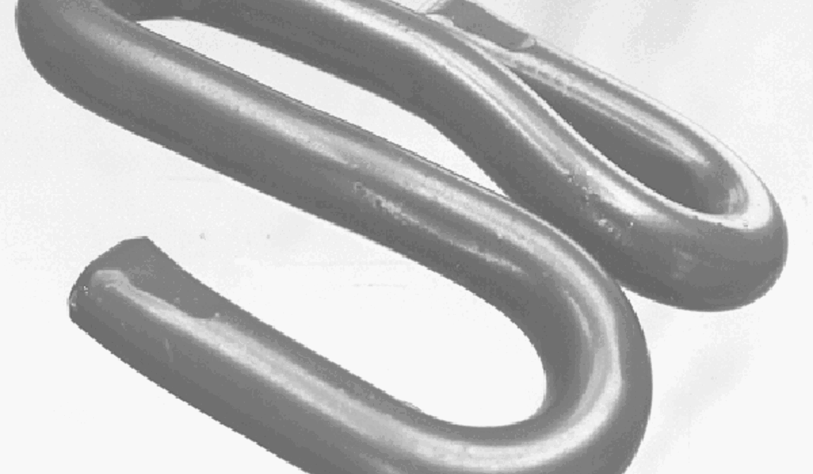 Pandrol Fastclip klemfjær i metall, brukt til skinnebefestigelse i moderne spor.